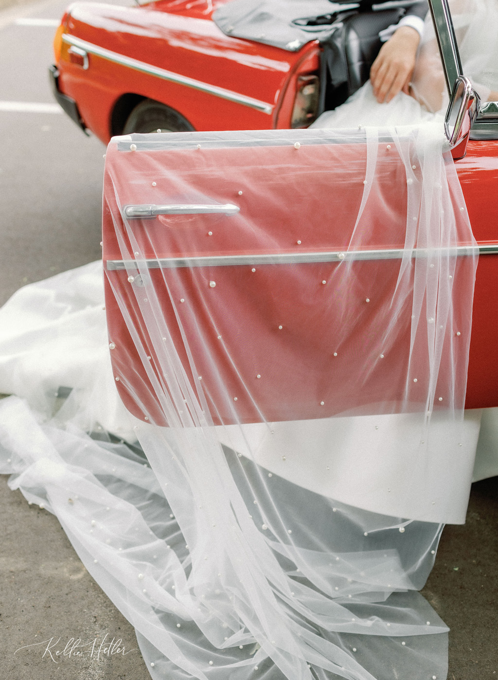 classic car with bride and pearl veil