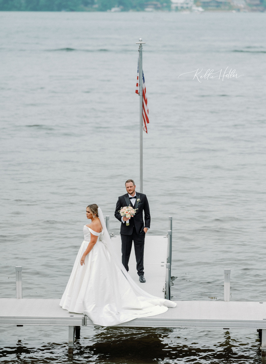 bride and groom on dock at bay pointe inn